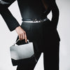 Модель із сумкою BLACKWOOD Fjord Black & White Python, студійна зйомка Black & White